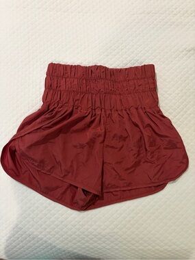 FP Movement by Free People High-Rise Smocked Athletic Shorts in Burgundy
